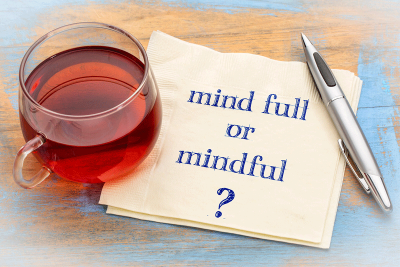 A close up of a napkin with a note that reads “mind full or mindful?” next to a glass of tea. Learn how a self fulfillment therapist in Ontario, CA can help you cultivate mindfulness techniques and achieve personal fulfillment in Toronto, CA. Search for “lack of fulfillment Toronto, CA” for more!